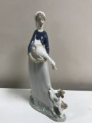 A Lladro figurine : Girl with Goose and Dog, 4866, height 27 cm, boxed.