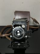A Zeiss Ikon folding camera in case