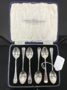 A set of six cased silver teaspoons