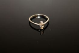 An 18ct white gold diamond solitaire ring,