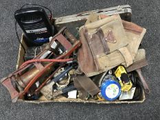 A box of hand tools, vintage foot pump, battery charger,