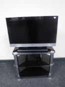A Sony Bravia 26 inch LCD TV on stand