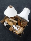 A box of wooden table lamps, storage jars,