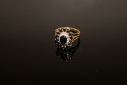 A 9ct gold sapphire and diamond cluster ring, size L CONDITION REPORT: 3.