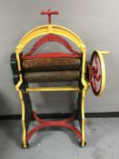 A hand-painted vintage cast iron mangle