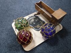 A tray of antique glass balls, miniature crib,