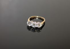 A fine quality three stone diamond ring, the total diamond weight estimated at 2.