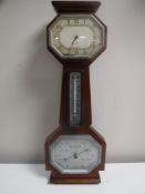 A mahogany barometer with silvered dial,