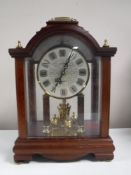 A Kundo quartz mantel clock CONDITION REPORT: Generally in good condition though