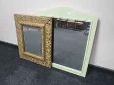 A painted framed mirror and an ornate gilt framed mirror