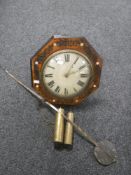 An antique time-piece with mother of pearl inlaid case together with two weights and pendulum