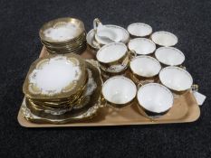 A tray containing approximately 35 pieces of Tuscan gilt tea china