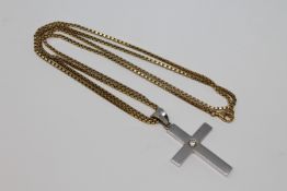 An 18ct white gold diamond set cross pendant on chain.