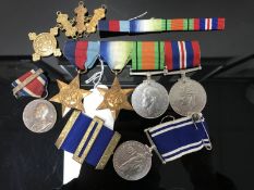 Four WWII medals, an Elizabeth II Police Service Medal,