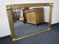 A large gilt framed overmantel mirror, a pine framed mirror,