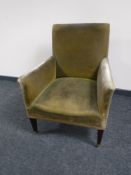 An Edwardian Regency style library armchair upholstered in green dralon