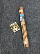 A set of wooden carpet rods with brass fittings