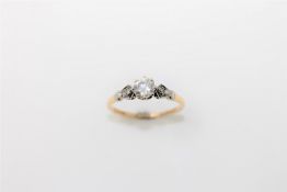 An 18ct gold solitaire diamond ring, the principal brilliant cut stone weighing an estimated 0.