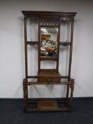 An Edwardian oak mirrored hall stand