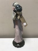 A Lladro figure of a geisha with fan (restored)