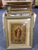 A box of assorted framed 20th century prints, Bovril advertising poster, religious prints,
