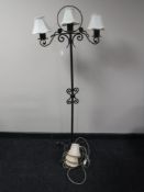 A cast metal three branch standard lamp