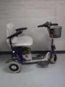 A Shop Rider mobility cart with key and battery charger