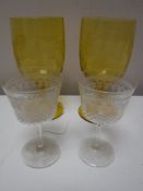 Two 19th century etched yellow glass goblets together with two liqueur glasses