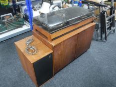 A mid 20th century Dynatron music centre with speakers and a teak double door cabinet