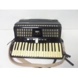 Baile Celeste, 80 bass piano accordion, black, with case.