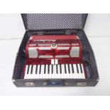 Paolo Soprani thirty-four key, seventy-two bass piano accordion, in marbled red,