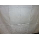 Large white damask tablecloth with woven Dickension scenes. 220cm long x 174cm wide.