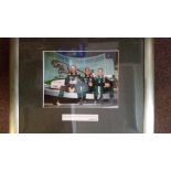 MOTOR RACING, signed colour photo by Eddie Irvine, full-length sitting with co-drivers & Jaguar car,