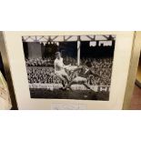 FOOTBALL, signed piece by Jack Charlton, overmounted with photo showing him in action for Leeds