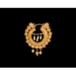 Graeco-Persian Gold Earring with Faces