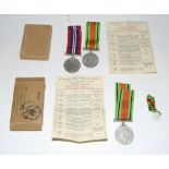 A WW2 Defence Medal in posting box addressed to JE Byrne and a WW2 Royal Air Force medal pair in