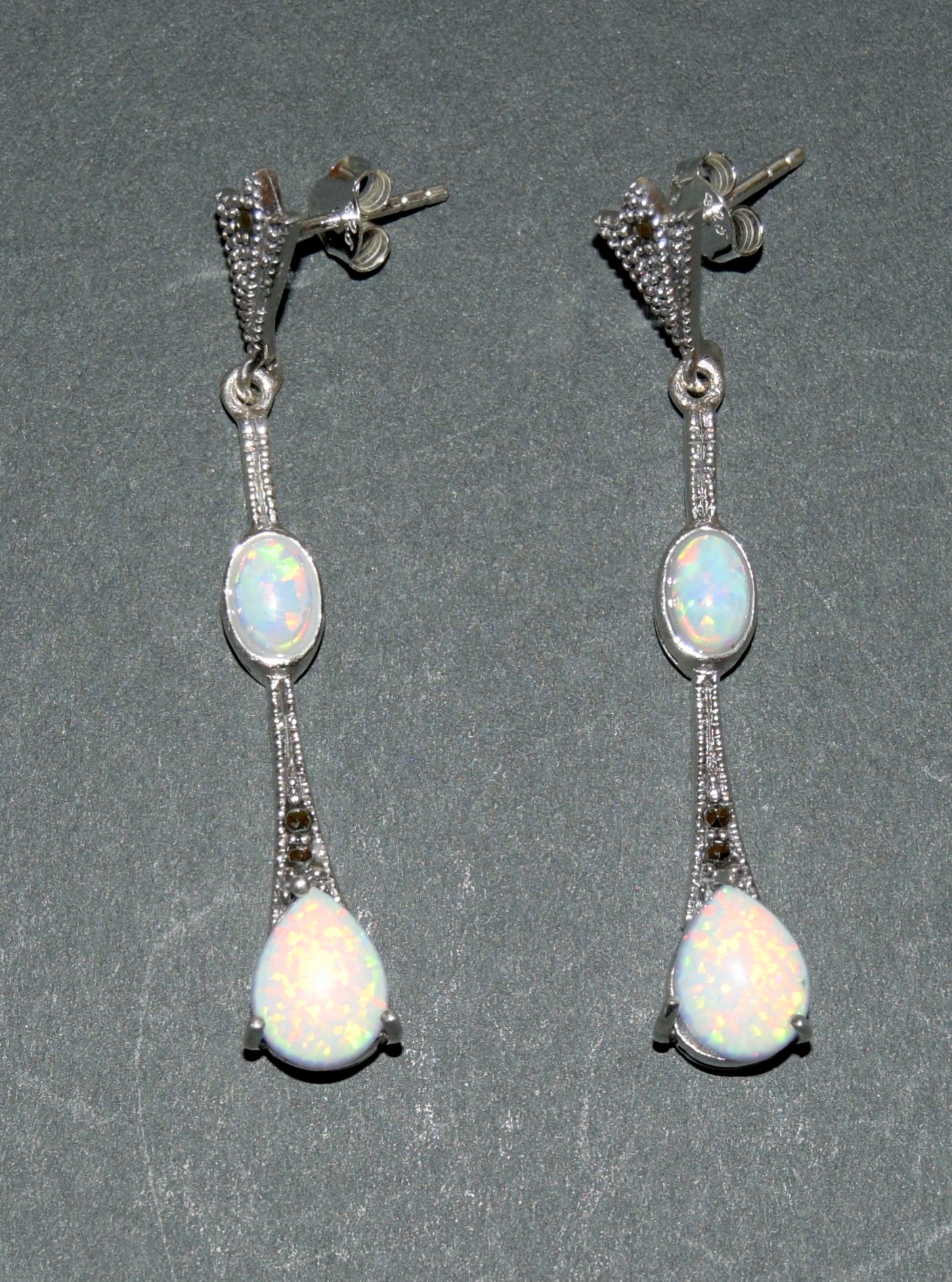 Pair of silver and opal drop earrings in the art deco style