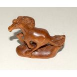 Japanese wooden horse shaped netsuke signed to the base