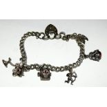 Silver charm bracelet together with 8 charms 28g