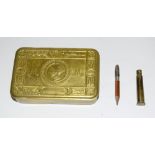 A WW1 Princess Mary tin with its original bullet pencil