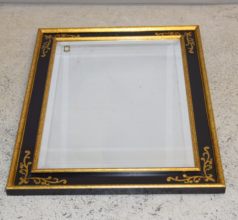 Black Lacquer and gilt framed bevelled edges mirror