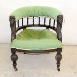 Ebonised carved tub chair on turned legs with bobbin back supports