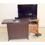Yamaha sound bar with a Warfdale TV blue ray dvd player controllers and a heat trolley
