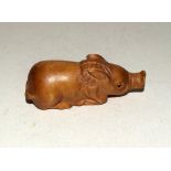 Japanese wooden pig netsuke signed to the base