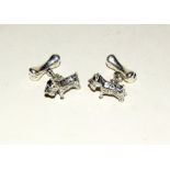 Pair of silver dog and bone cufflinks