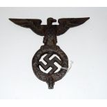 A reproduction Third Reich cast iron Nazi Eagle standard finial 19.5cms wide by 17cms high