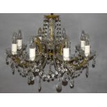 Ornate 8 Branch chandelier with scroll arms and tear shaped lustre drops