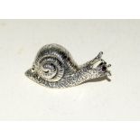 Unusual silver figure of a snail with ruby eyes