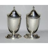 Silver pair table peppers