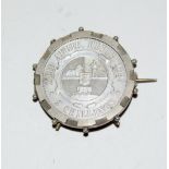 An 1897 South Africa 2 Shillings coin in its silver brooch mount